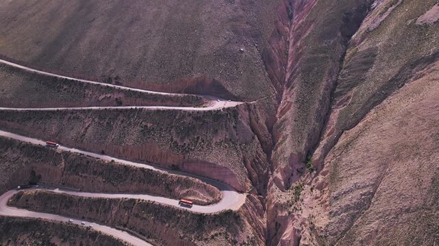 4K drone aerial view of Cuesta de Lip&aacute;n, Jujuy, Argentina. Spectacular winding mountain road climbing through the Andes with dramatic curves, rugged landscapes and breathtaking high altitude scenery.