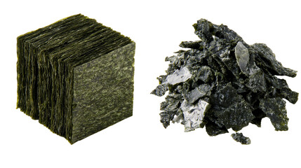 Stacked square sheets of dried nori seaweed and a pile of crushed nori flakes © Lubos