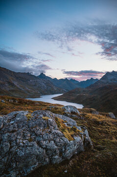 Twilight sky over a rugged mountain lake in Norway