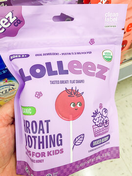 Lolleez organic throat soothing pops for kids bag held in store aisle - Auburn WA USA - August,21 2026
