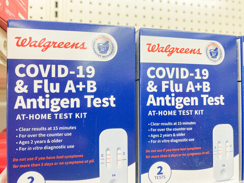 Walgreens COVID 19 and Flu AB antigen test kits on pharmacy shelf. - Auburn WA USA - August,21 2026