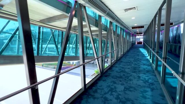 Modern Airport Terminal Glass Walkway Passenger Corridor Boarding Bridge Interior Architecture Aviation Travel Departure Entrance Bright Architectural Design Stock Video Footage