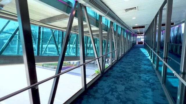 Airport Terminal Pedestrian Bridge Glass Window Corridor Boarding Tube Architecture Modern Transport Travel Infrastructure Departure Lounge Aviation Passenger Transit Motion Video Footage