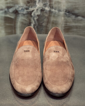 Beige suede slip-on moccasins with a metallic TODS logo on the upper.Milan - Italy,29 August 2026