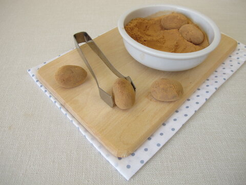 Homemade marzipan potatoes or marzipan eggs with low-histamine carob powder as a substitute for cocoa