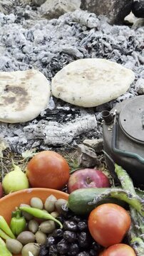 Vertical Video of a Mountaineer's Traditional Summit Breakfast by a Campfire
