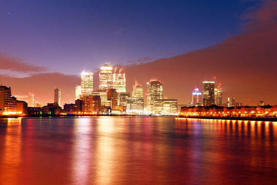 UK, London, skyline with Canary Wharf skyscrapers at dawn