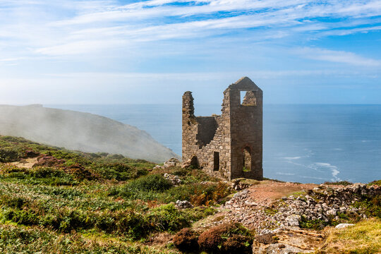 Ruined Botallack Mine on a foggy cliff in West Cornwall