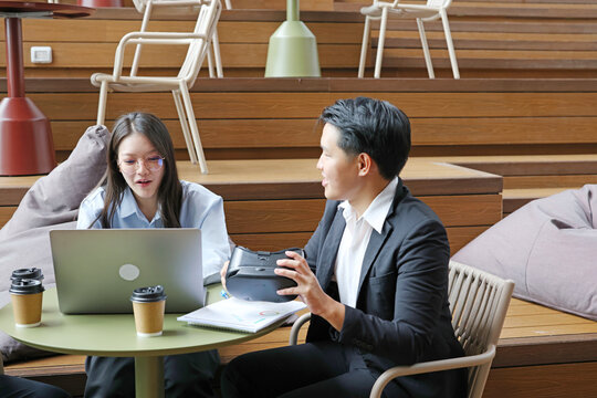Business Professionals Discussing Virtual Reality Technology in Modern Office Space
