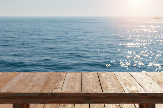 Wood balcony table overlooking calm blue sea with sunlight reflections and open horizon, creating peaceful coastal setting for summer travel
