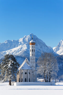 Germany, Bavaria, View of St Coloman Church in front of Tannheim Mountains
