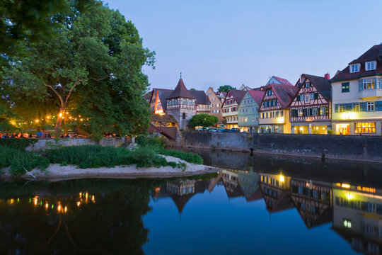 Architecture reflects in the Kocher river at dusk in Schw�bisch Hall