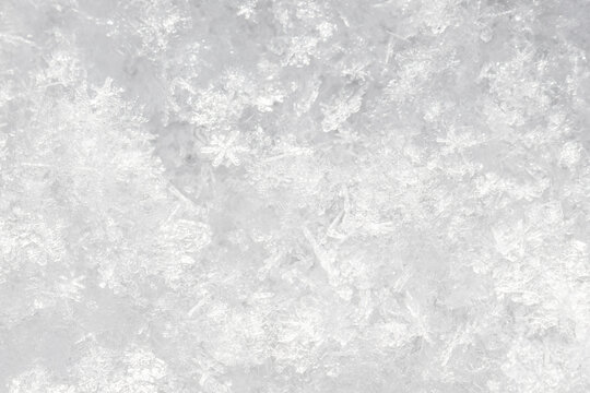 Crystalline ice patterns form a textured, frosty surface