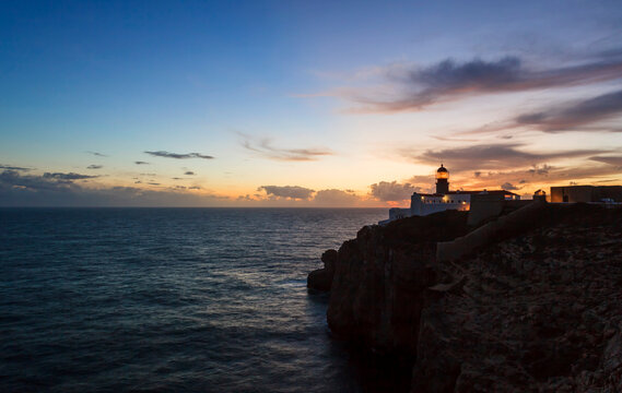 Farol do Cabo de S. Vicente overlooks the ocean at sunset in Sagres