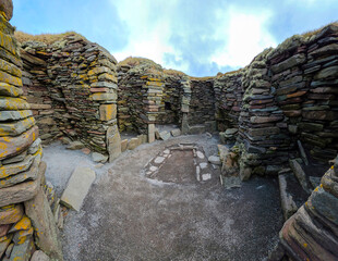 jarlshof prehistoric and norse archaeological site in Shetland, Scotland. Wheelhouses are unique Iron Age stone dwellings featuring a central hearth surrounded by radial stone piers © Janos