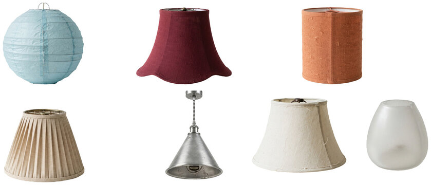 A set of assorted lamp shades in varied shapes, materials, and colors for home lighting concepts.
