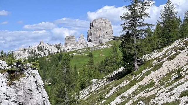 Iconic, dreamlike Dolomites. The Tofane and the Five Towers in summer. From hiking to climbing.