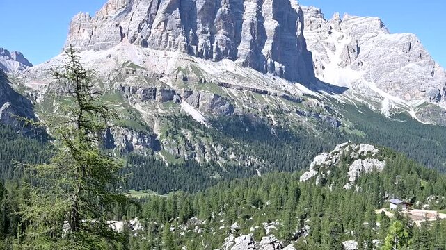 Iconic, dreamlike Dolomites. The Tofane and the Five Towers in summer. From hiking to climbing.