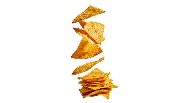 Stacked and falling crispy golden corn tortilla chips