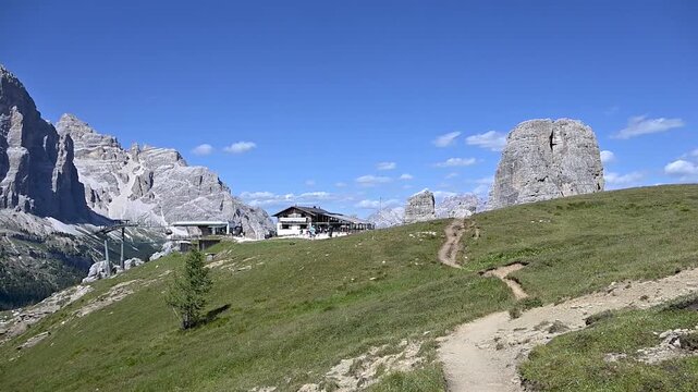 Iconic, dreamlike Dolomites. The Tofane and the Five Towers in summer. From hiking to climbing.