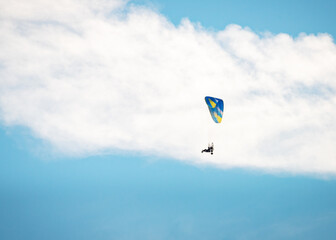 Sportsman flying with motorglider through dark clouds enjoying adrenaline © Ewald Fröch