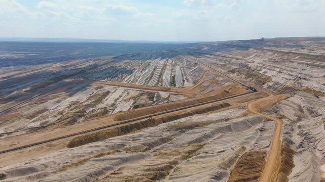 Hambach open pit mine operation area, mining lignite with solar panel photovoltaic modules, change to renewable sustainable energy
