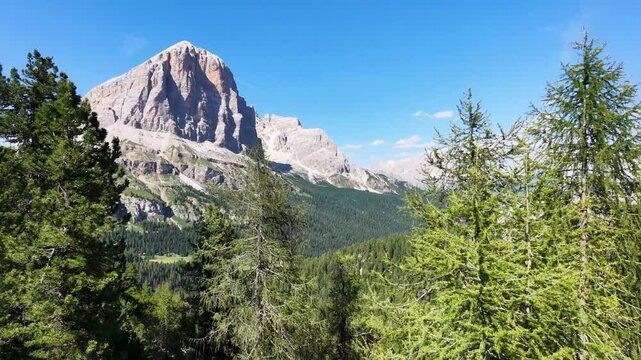 Iconic, dreamlike Dolomites. The Tofane and the Five Towers in summer. From hiking to climbing.