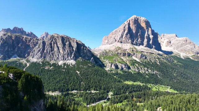 Iconic, dreamlike Dolomites. The Tofane and the Five Towers in summer. From hiking to climbing.