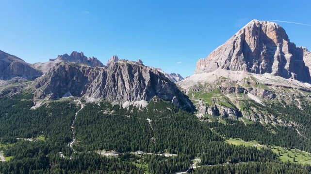 Iconic, dreamlike Dolomites. The Tofane and the Five Towers in summer. From hiking to climbing.