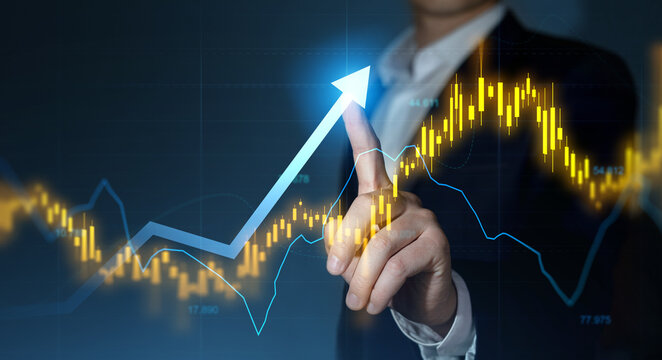 Trader analyzing data on virtual screen.Price graph and indicator. Stock market invest and crypto currency. Stock market and business investment.	