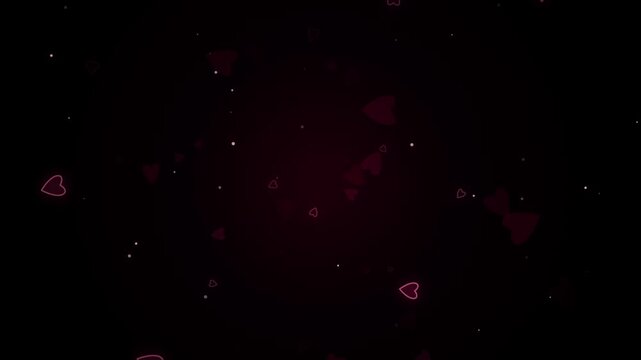Romantic glowing pink heart particles float and sparkle on a dark background creating a magical
