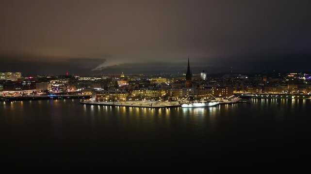 Stockholm, Sweden, Aerial View of City at Night, Riddarholmen Church and Ferry Terminal, Coastal Street Traffic