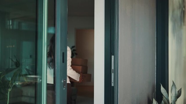 Woman, front door and boxes with delivery man, logistics and supply chain with friendly service. People, home and smile with package, parcel distribution and customer receiving with shipping or order