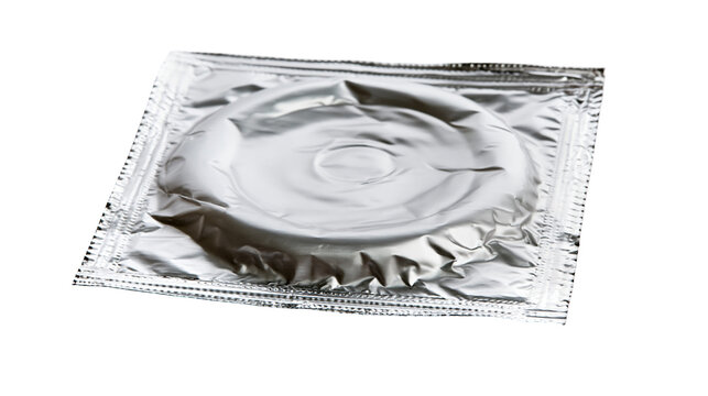 Silver metallic foil condom wrapper with circular contraceptive product inside