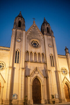 Monumental facade of the neo-Gothic Church of Our Lady of Mount Carmel with bell towers and rose windows, St. Julian's MALTA