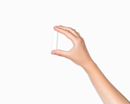 Hand Holding Small White Plastic Nasal Inhaler On White Background