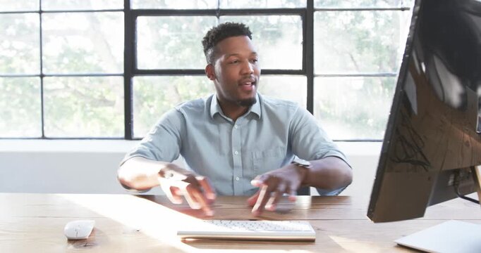 Lifestyle videos indoor of people doing activities at office, typing on keyboard, man working in mod