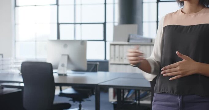 Close up of people talking to the camera, pointing in office, woman giving presentation near desks a