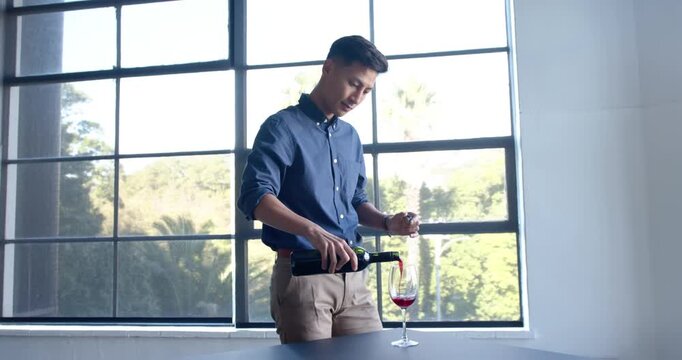 Lifestyle videos indoor of people doing activities at office, businessman holding wine glass and exa
