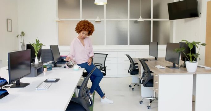 Lifestyle videos indoor of people doing activities at office, woman standing in modern office with c