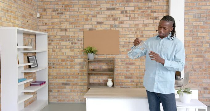 Lifestyle videos indoor of people doing activities at office, man standing in modern office with bri