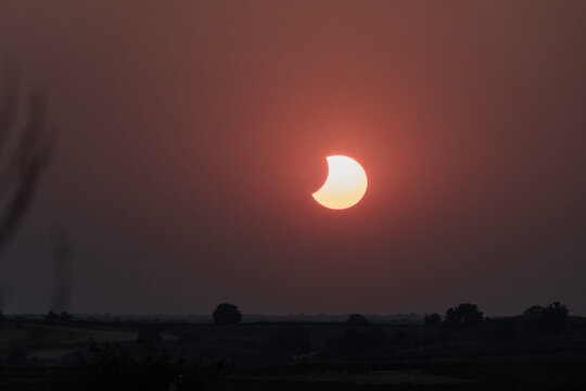 View of the partial solar eclipse, during partiality, in the countryside around San Juan del Monte, Burgos
