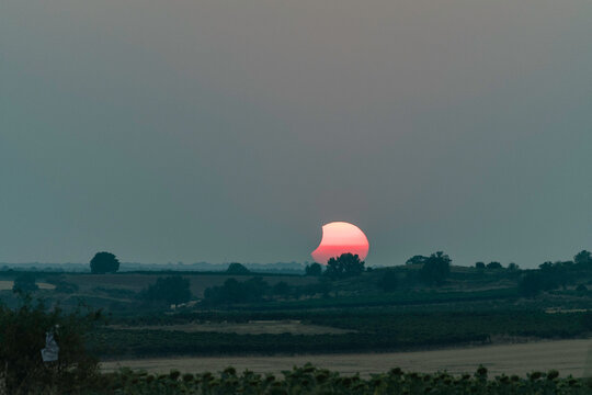 View of the partial solar eclipse, during partiality, in the countryside around San Juan del Monte, Burgos

