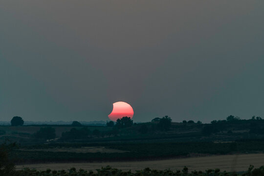 View of the partial solar eclipse, during partiality, in the countryside around San Juan del Monte, Burgos

