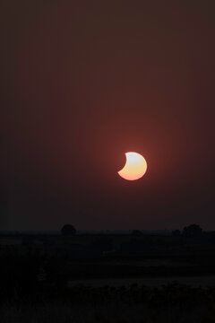 View of the partial solar eclipse, during partiality, in the countryside around San Juan del Monte, Burgos
