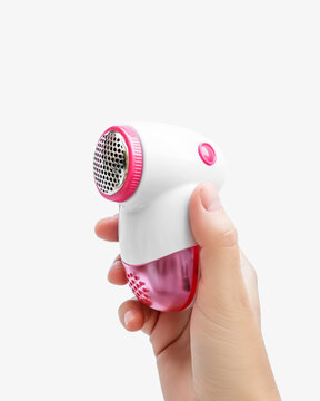 Hand Holding Fabric Shaver Lint Remover on White Background