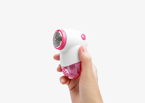 Hand Holding Fabric Shaver Lint Remover on White Background