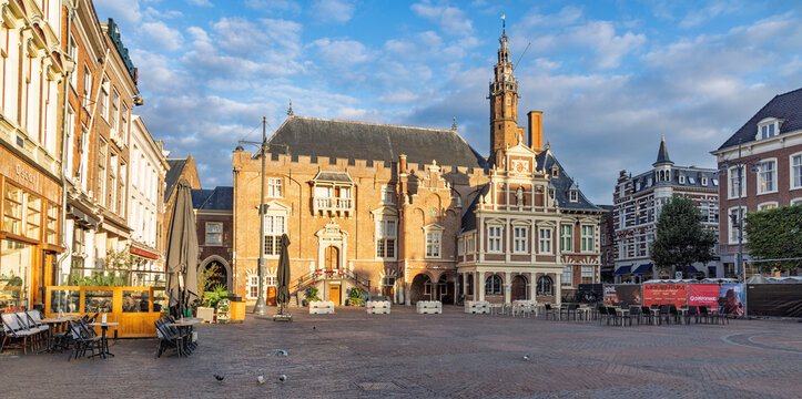 Haarlem, Netherlands - 16 August 2026. Sunlit main square Grote Markt featuring the historic City Hall Stadhuis and outdoor cafe terraces.