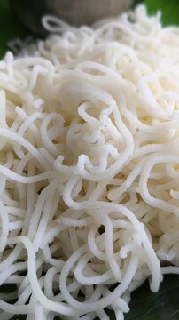 Idiyappam, also known as indiappa, noolappam, noolputtu, sheveo, santhagai, or ottu shavige, is a string hopper dish originating from southern India. It consists of rice flour pressed into noodles.