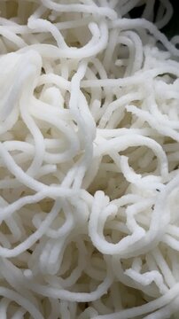 Idiyappam, also known as indiappa, noolappam, noolputtu, sheveo, santhagai, or ottu shavige, is a string hopper dish originating from southern India. It consists of rice flour pressed into noodles.